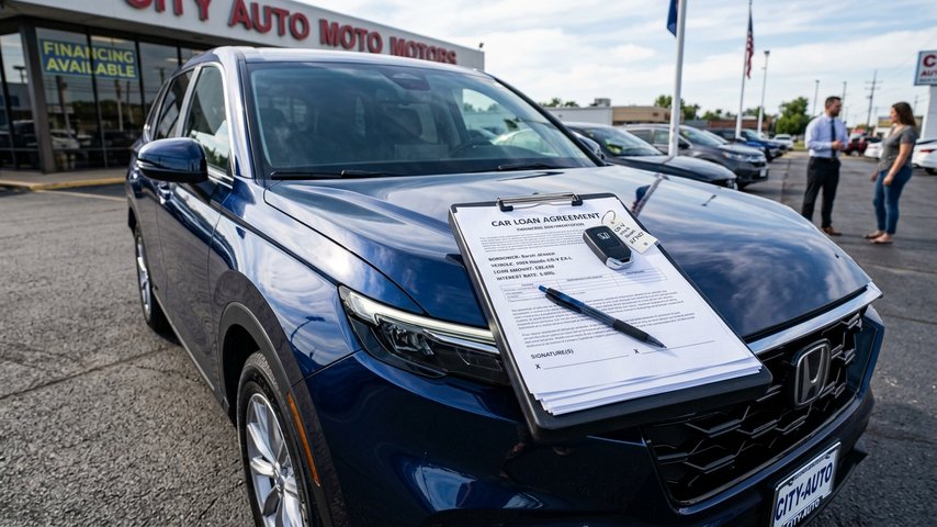 Car_loan_documents_beside_car_20260915220558_2